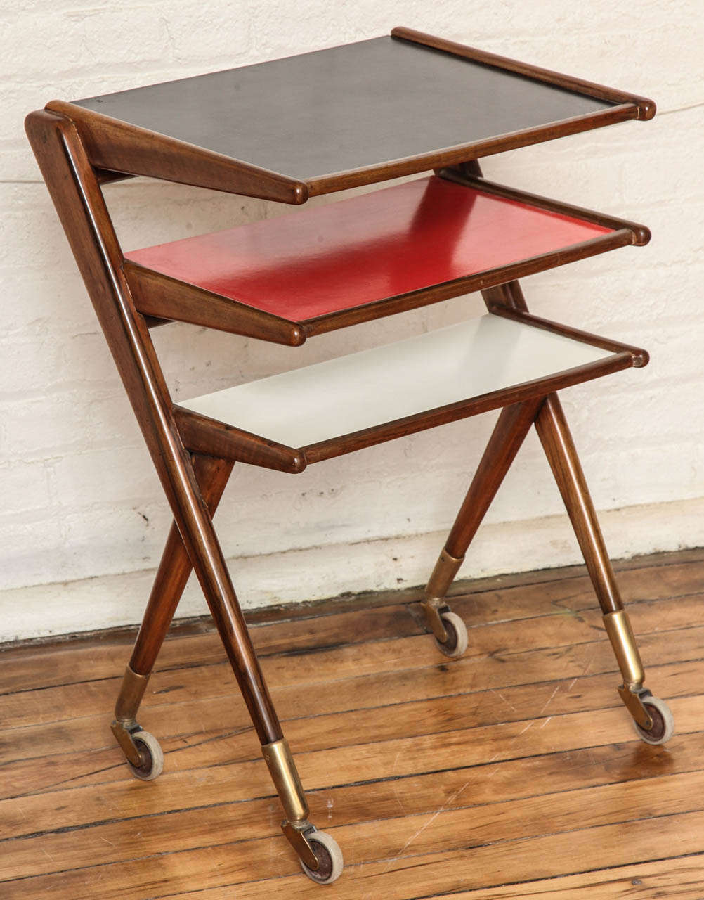 Modernist rolling side table magazine rack.