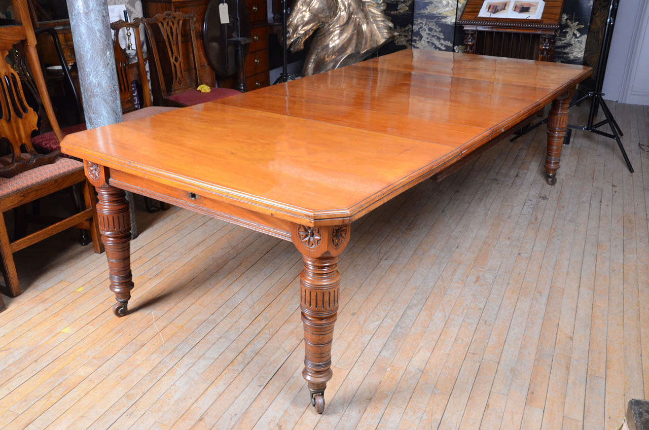 A fine Aesthetic Movement period mahogany extending dining table retaining the makers’ label “Samuel Edwards, Registered October 17th 1879, Flap Case Dining Table”.
The top with caddy moulded edge and canted corners on finely turned legs topped