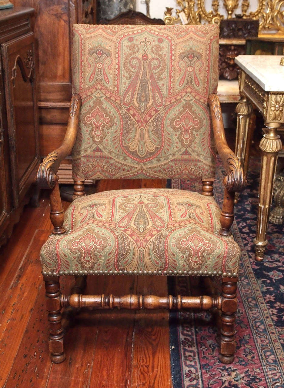 French Late 19th century walnut tall back armchairs with paisley upholstery.