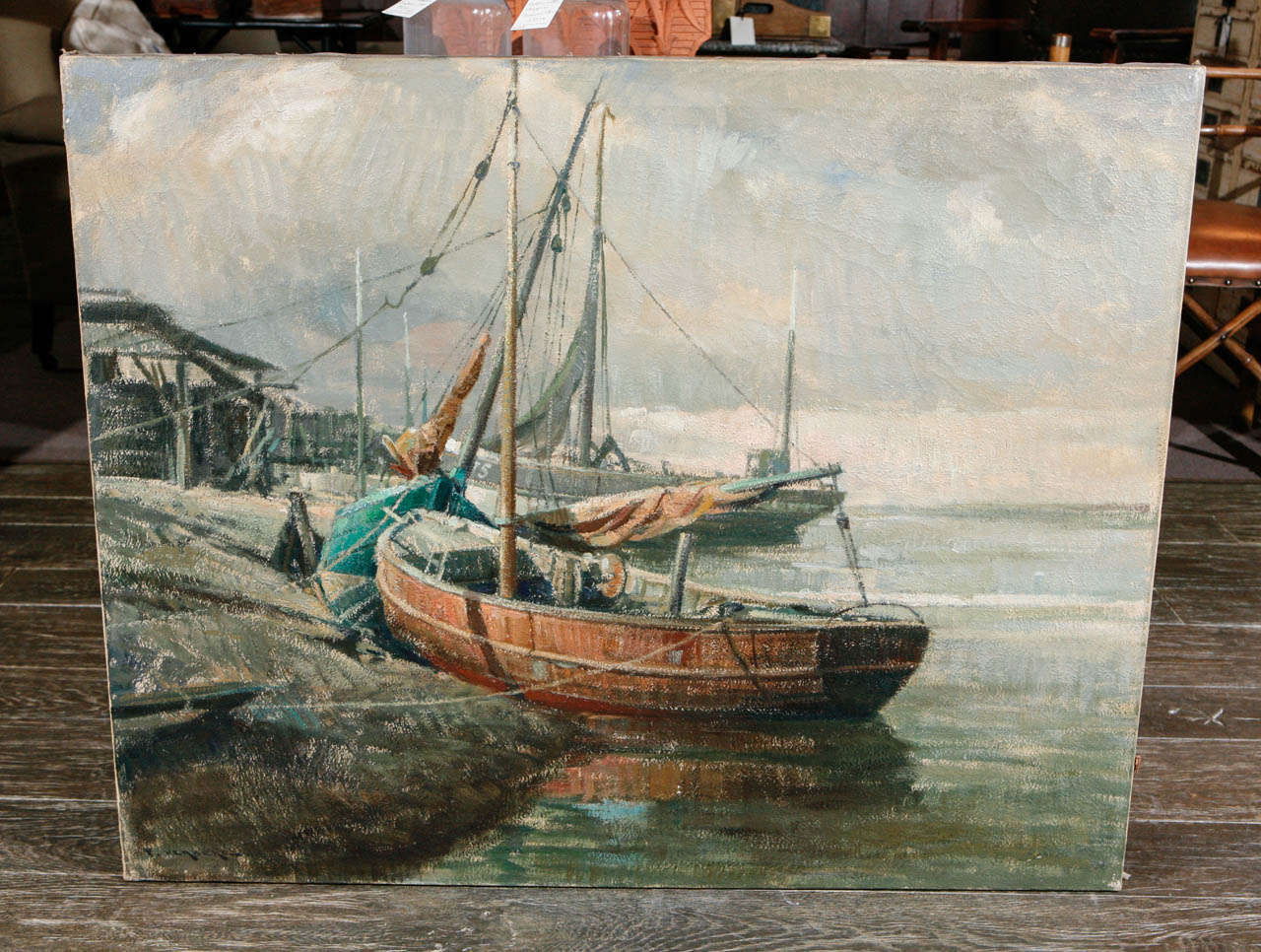 Early 20th century Belgian oil on canvas of boats at the shore. (Unframed).