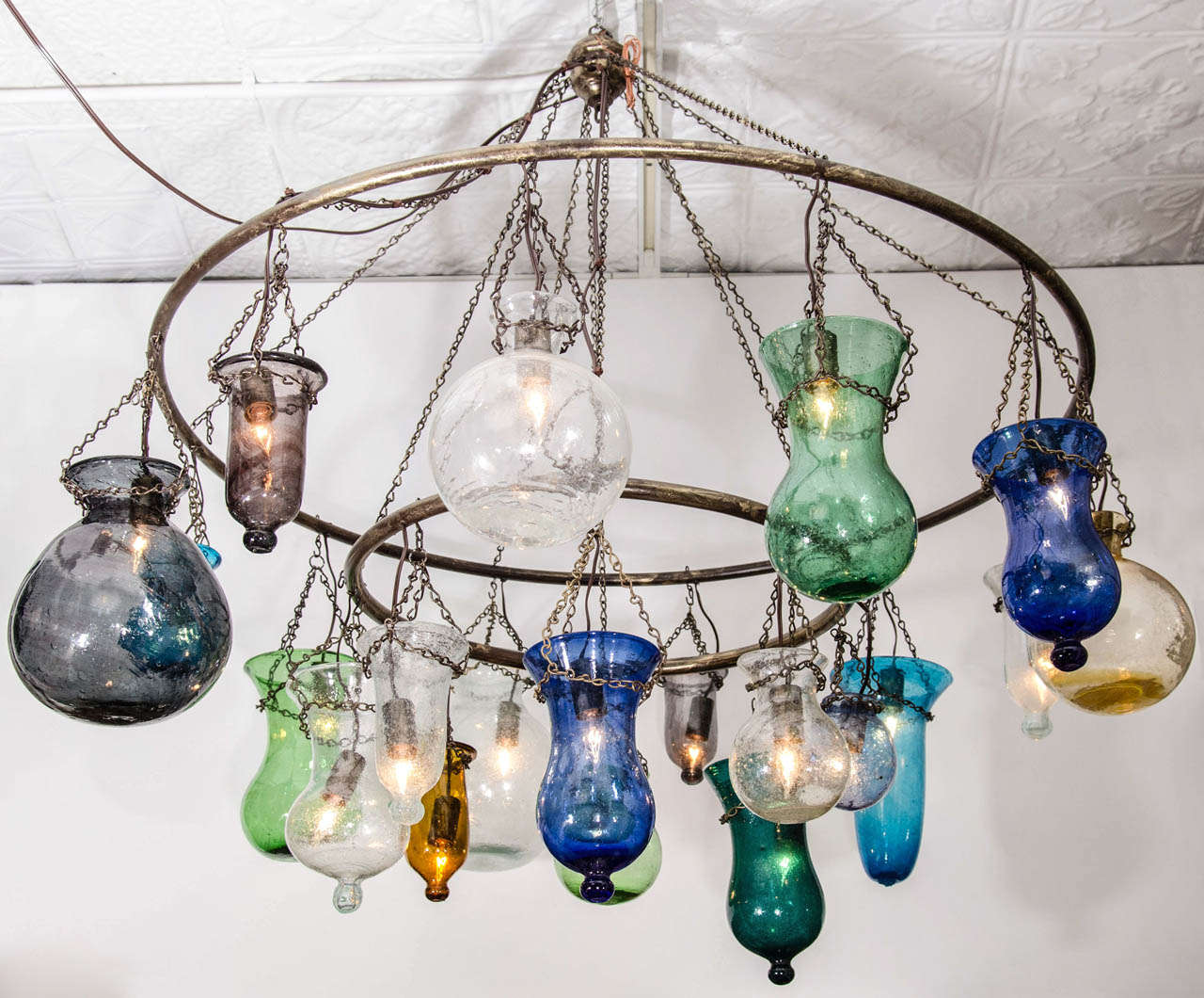 Two-tiered inverted handblown glass chandelier, in assorted colors and sizes.