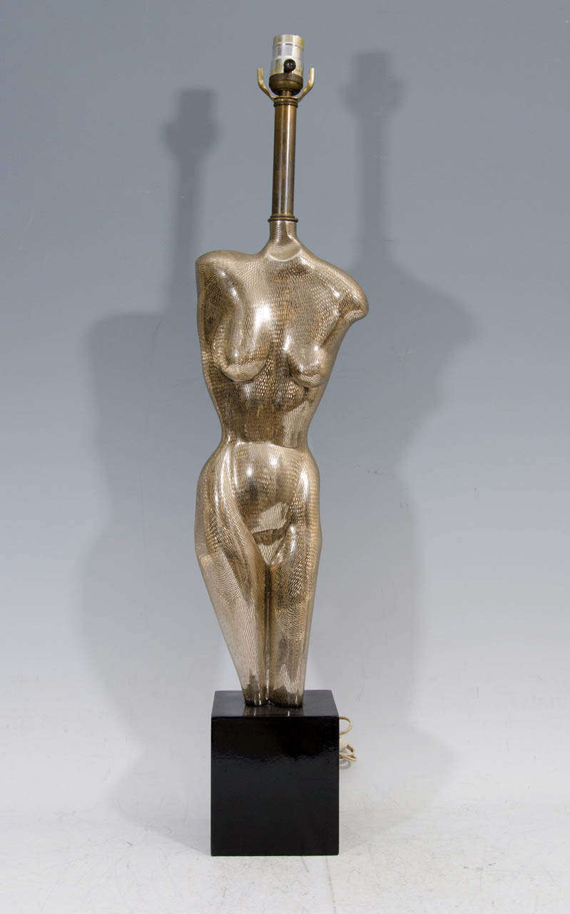 A vintage pair of female figural sculptural lamps by Yasha Heifetz; these stunning torso figures in metal over block form pedestal bases, each support a single socket on elongated stem, creating a highly unusual surrealistic appearance. Good