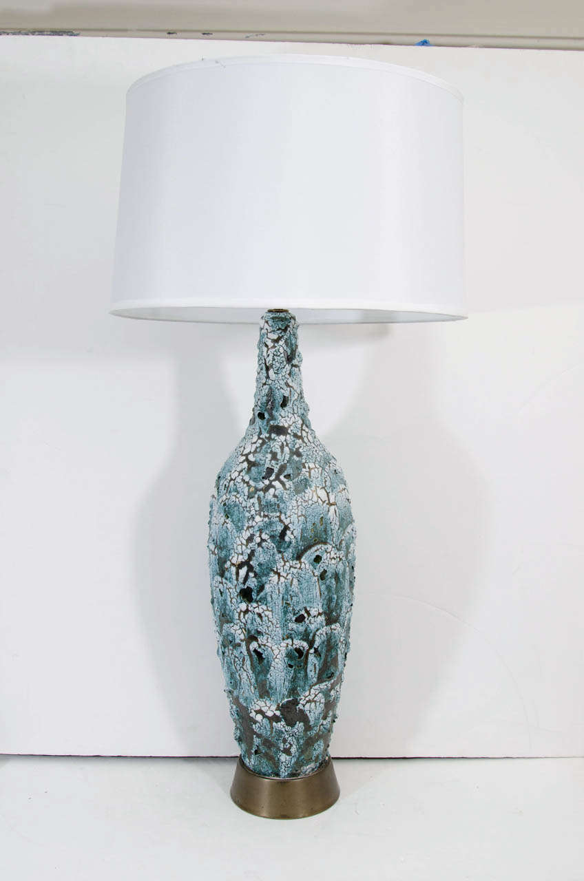 A vintage blue and white lava glaze ceramic table lamp with metal base.