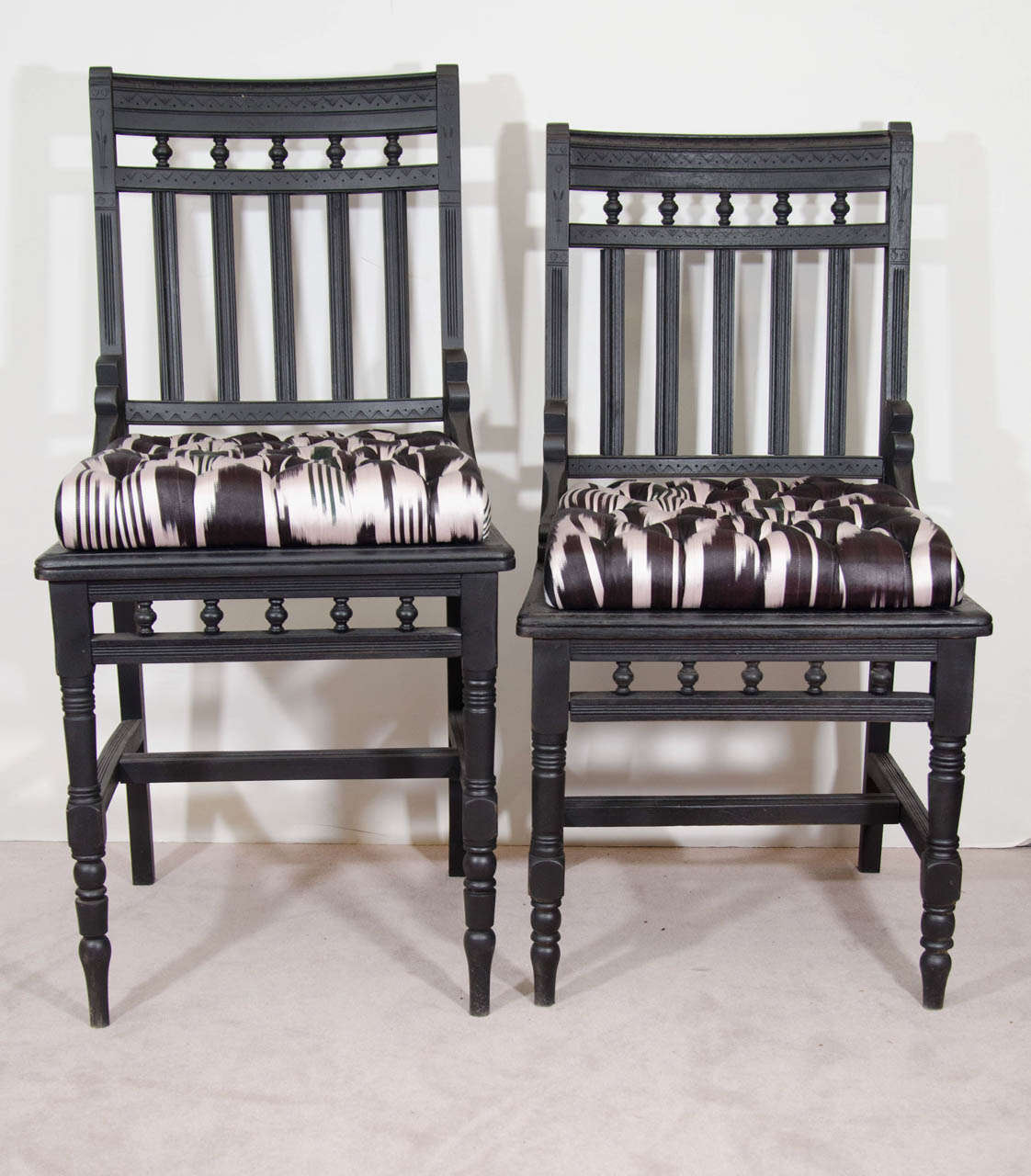 A pair of ebonized wood Eastlake his and hers antique side chairs newly re-upholstered in silk Ikat.

His: 40" H x 19" W x 16" D x 24" S
Hers: 36" H x 19" W x 16 D x 21" S

May be sold individually: $725 ea