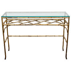 A Mid Century Glass and Faux Bamboo Console Table