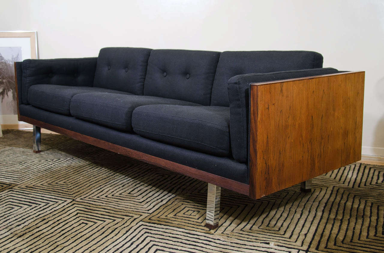 A vintage sofa with a wood frame and chrome legs by Danish maker Jydsk Mobelvaerk .  Newly reupholstered in black basket weave linen.