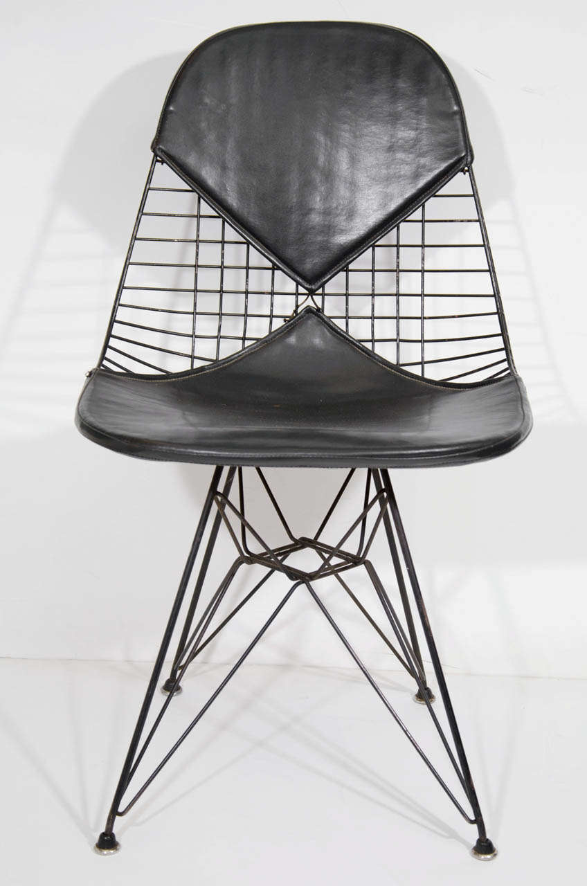 A set of four vintage early edition side chairs by Charles and Ray Eames for Herman Miller consisting of the 