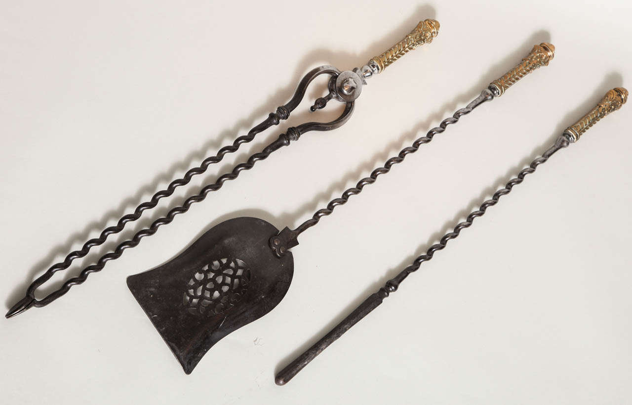 Very fine set of 19th century gunmetal fire tools with barley twist shafts, the shaped pierced shovel with oval lace design, the handles boldly cast in bronze with patera and acanthus leaf decoration.