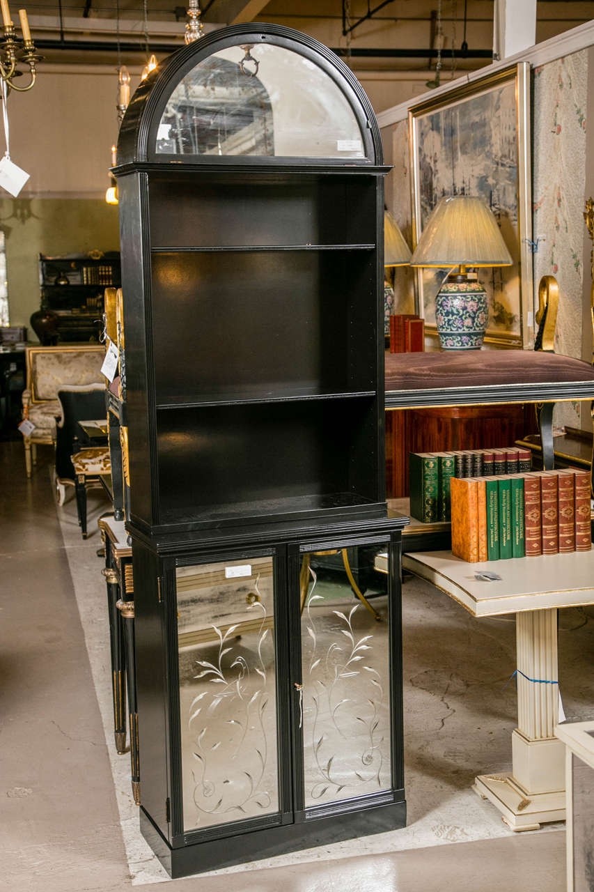 Fantastic pair of etched mirror ebonized dome bookcase étagère' cabinets attributed to Maison Jansen. Exquisitely detailed etching of several wondering vines with glorious peacocks etched in the center of each vined mirror door. Three spacious