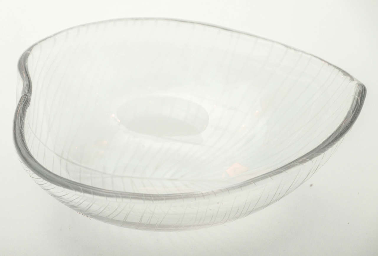 Wirkkala bowl made by Iitala,  Stylized leaf form with etched veins.  Signed by spine.  Made in Finland, circa 1960