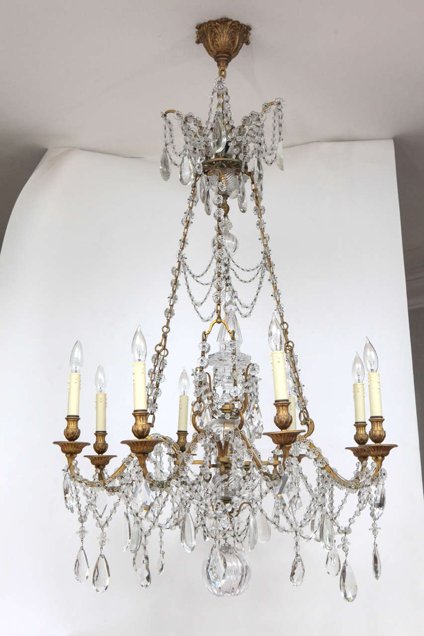 19th century French, doré bronze and crystal chandelier in the neoclassical style. Originally purchased in Europe for 35,000.00 Euros. The chandelier has been newly wired.