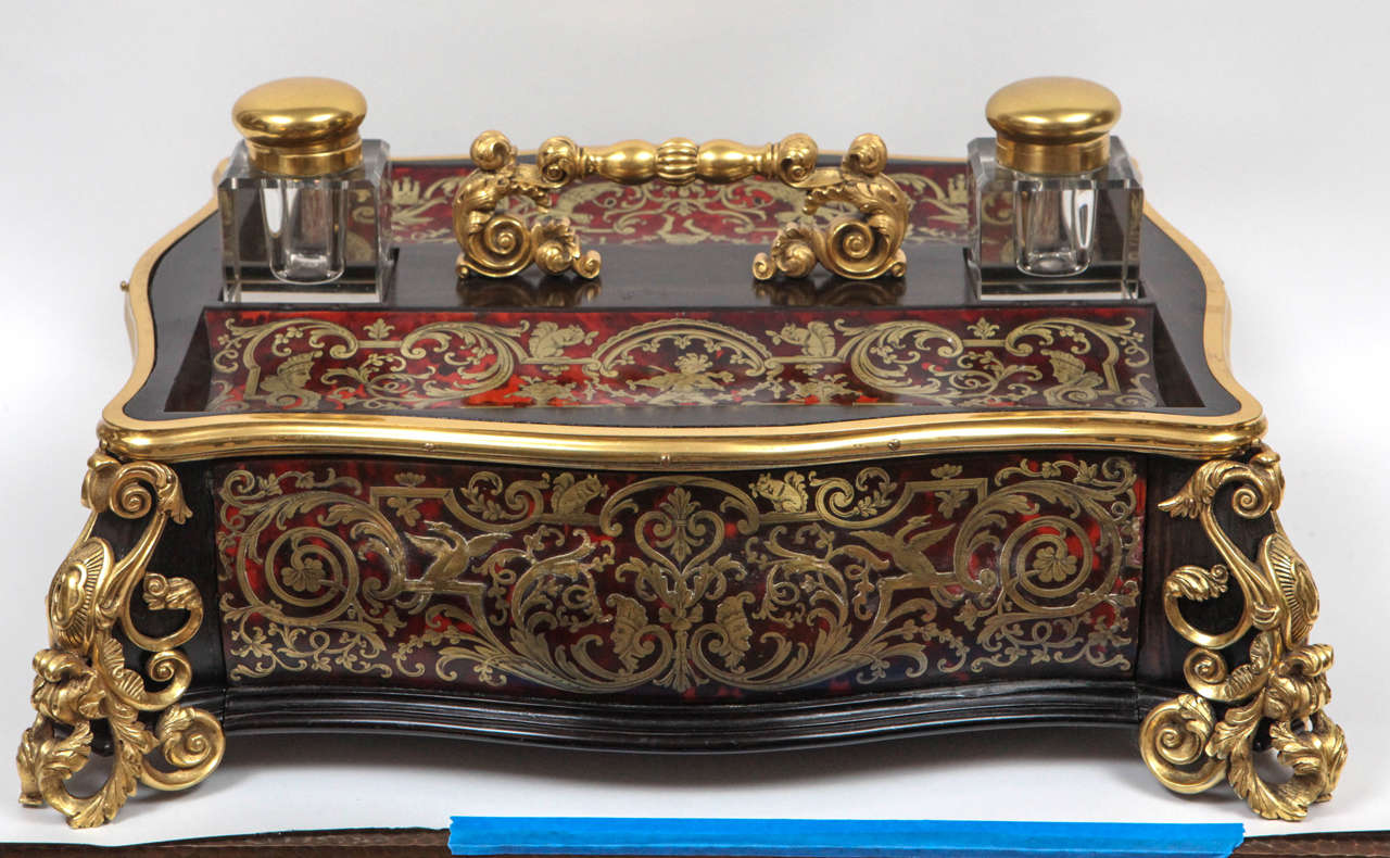 19th century stunning French oversized Boulle ink stand with a single drawer. The ink stand is embellished with tortoise shell and doré bronze mounts.