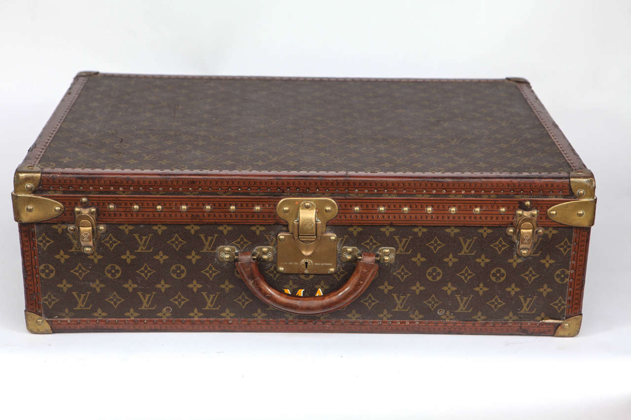 Vintage Louis Vuitton hard case luggage with brass detail and monogram 