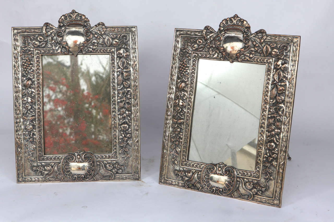 Pair of late 19th century English silver on copper standing or hanging mirrors.