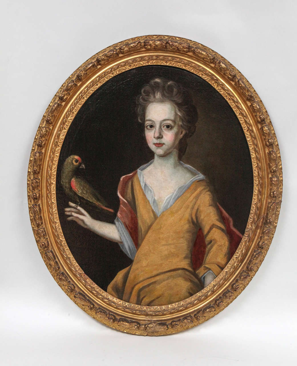 Late 18th c. French Oil Portrait Painting of Lady Holding a Bird in original Giltwood frame.