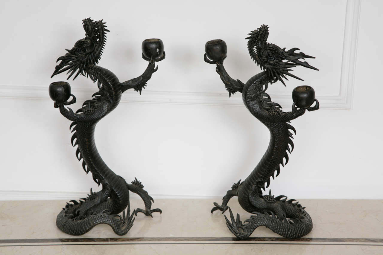A Pair of Japanese Dragon Candle Sticks, in Bronze 1868 - 1912

