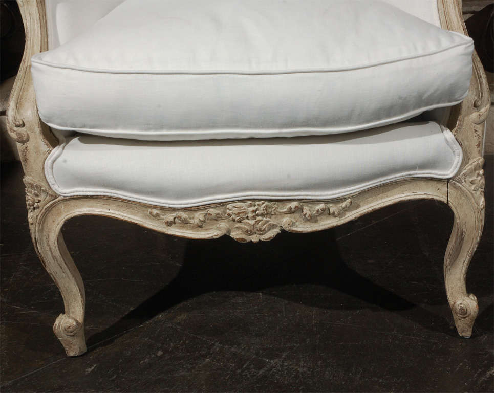 French Carved french upholstered arm chair . 