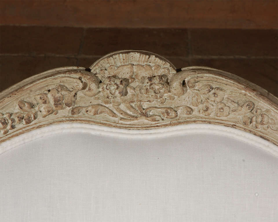 Carved french upholstered arm chair .  In Excellent Condition In Los Angeles, CA