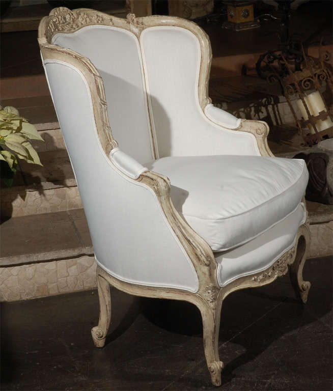 20th Century Carved french upholstered arm chair . 