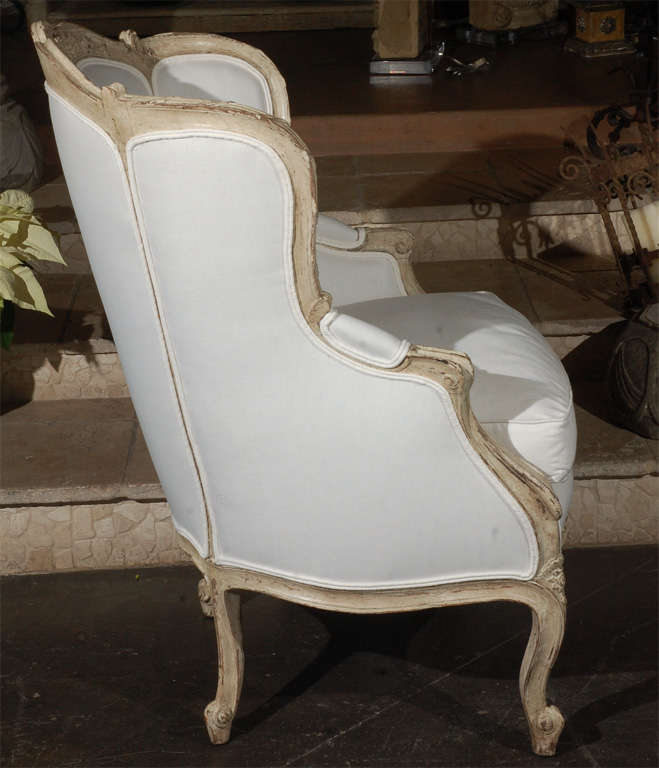 Carved french upholstered arm chair .  1