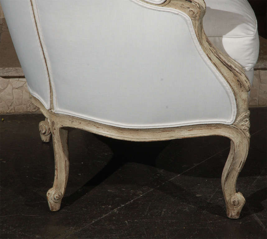 Carved french upholstered arm chair .  2