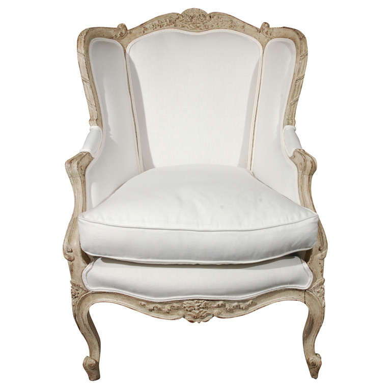 Carved french upholstered arm chair . 