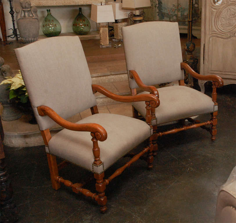 Pair of open arm chairs . Upholstered in belgian linen . 