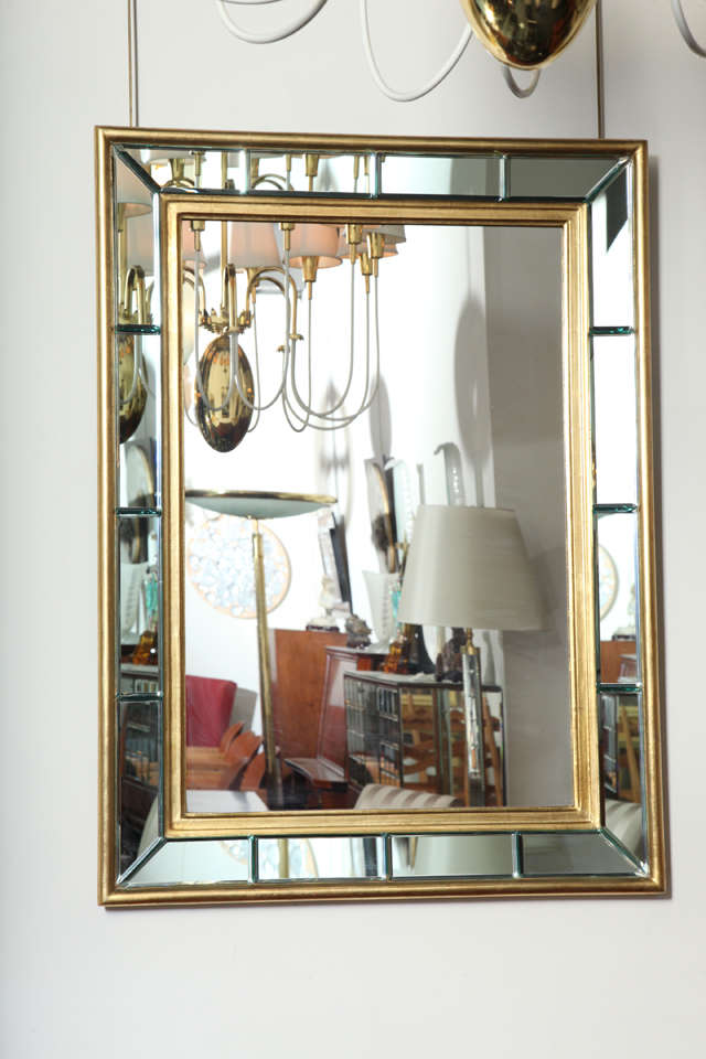 Stunning gold leafed Art Deco mirror with 16 bevelled glass panels, made in 1940s in Milan.
Great quality.
 