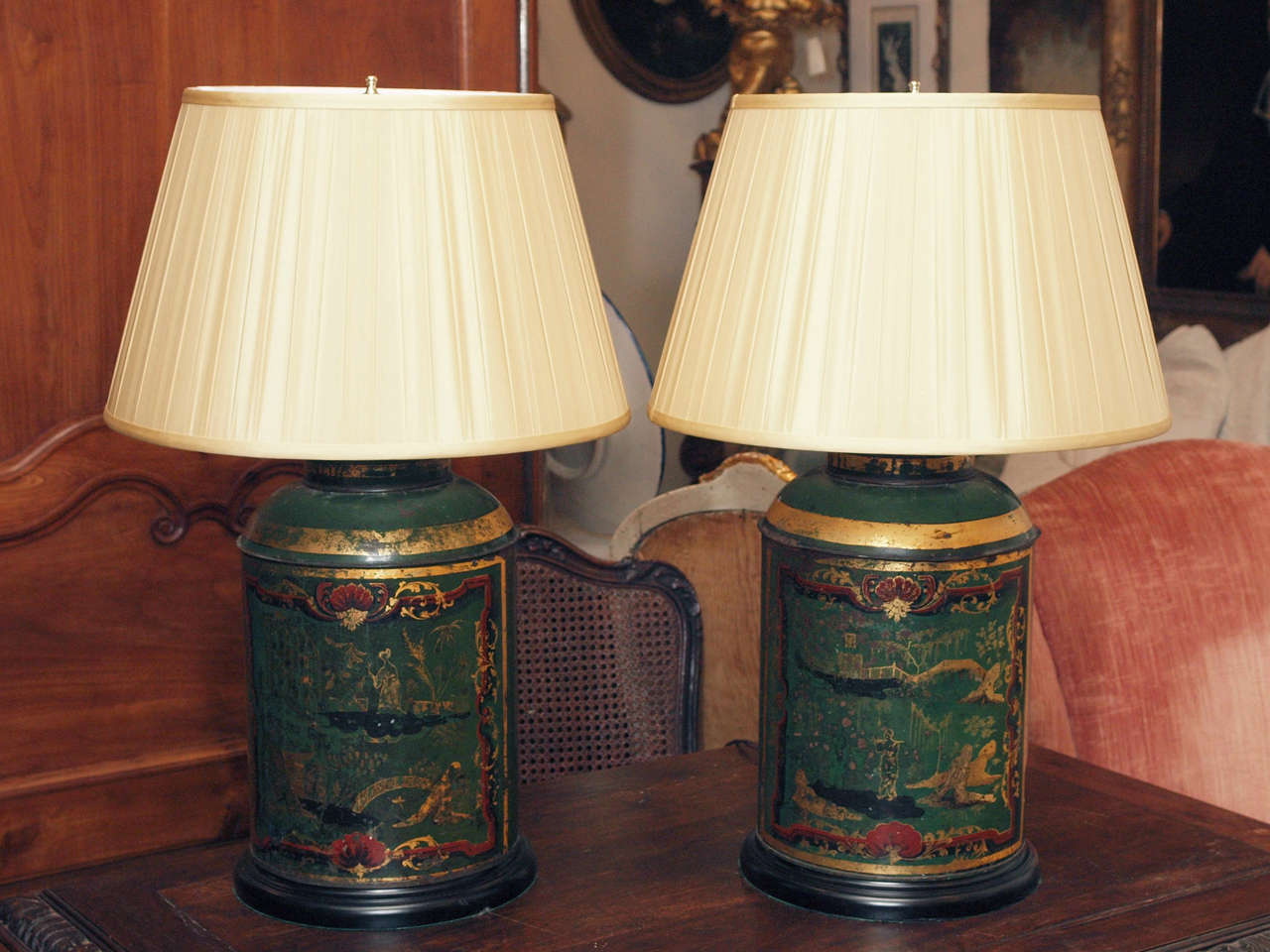 Pair of French Tea Tins in parrot green with gilt, black and rouge decoration in the Chinese taste.
having silk shades and wooden bases. now wired for US current.