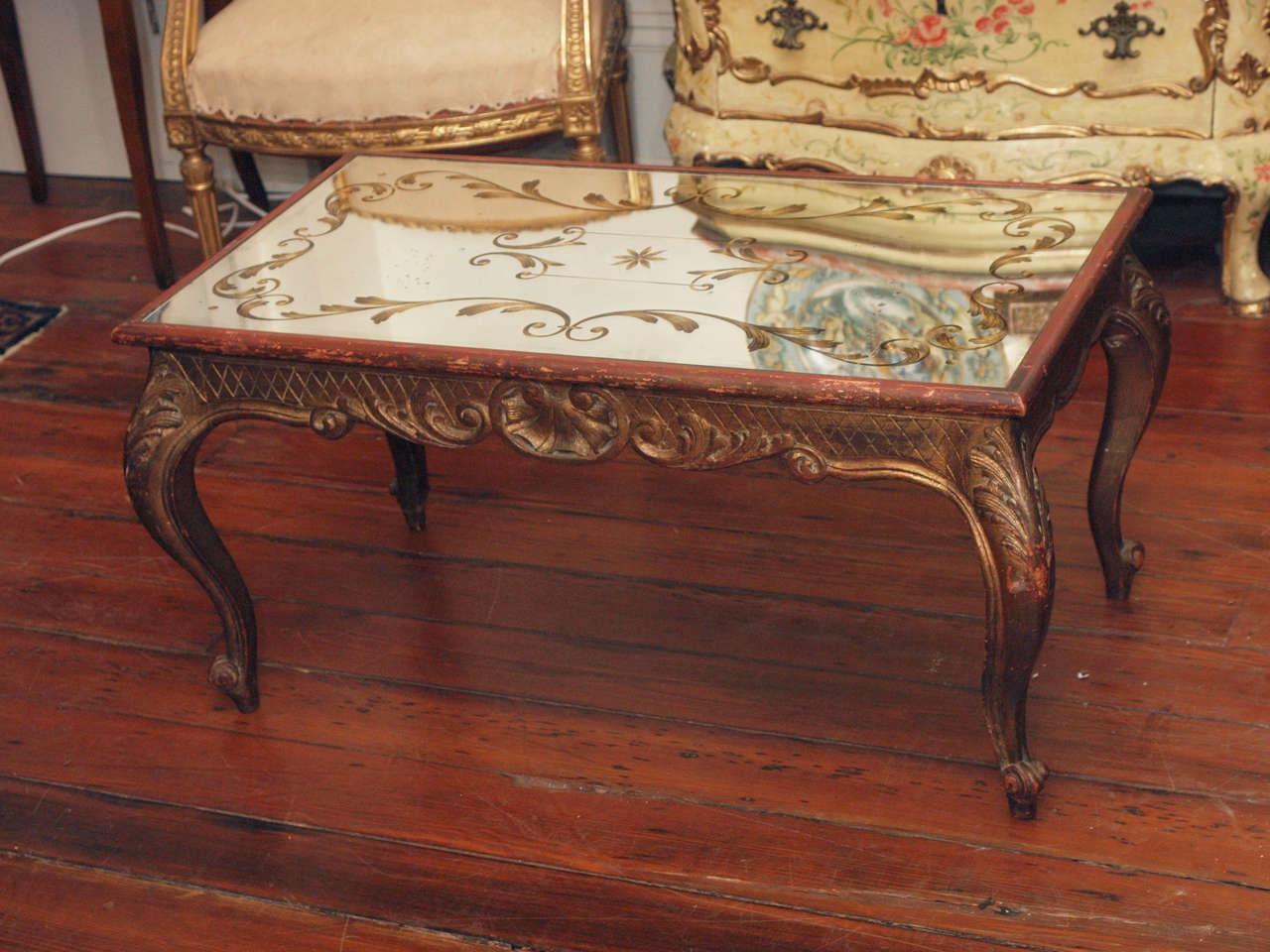 French Gilt Wood Louis XV style Coffee Table with Etched and gilt mirrored top from the 1940's.
