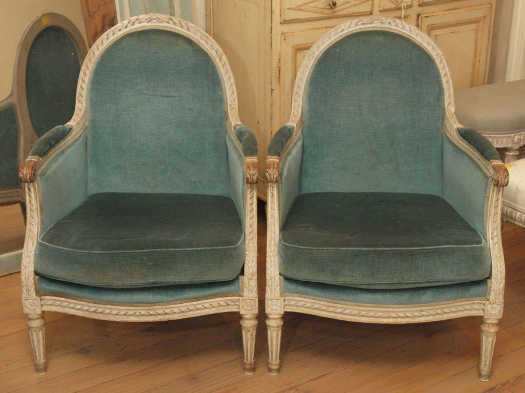 PAIR of 19th C Louis XVI Bergeres with Arched top back,  generous proportions,  painted hand carved wood frame.