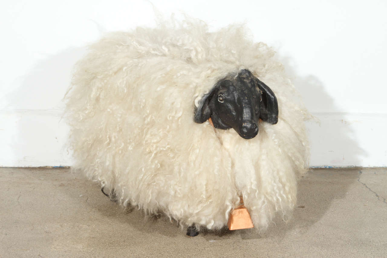 Mid Century Sheep sculpture after Francois- Xavier Lalanne.
Modernist wooden carved sheep with real sheep skin long wool with a cute wooden face and foot.