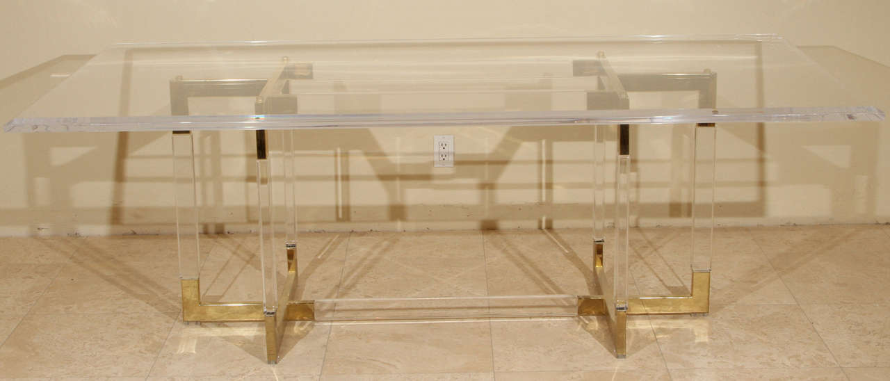 Lucite and Brass Metric line dining table by Charles Hollis Jones. The table has beautiful lines with  brass appointments and it still retains the original 3/4