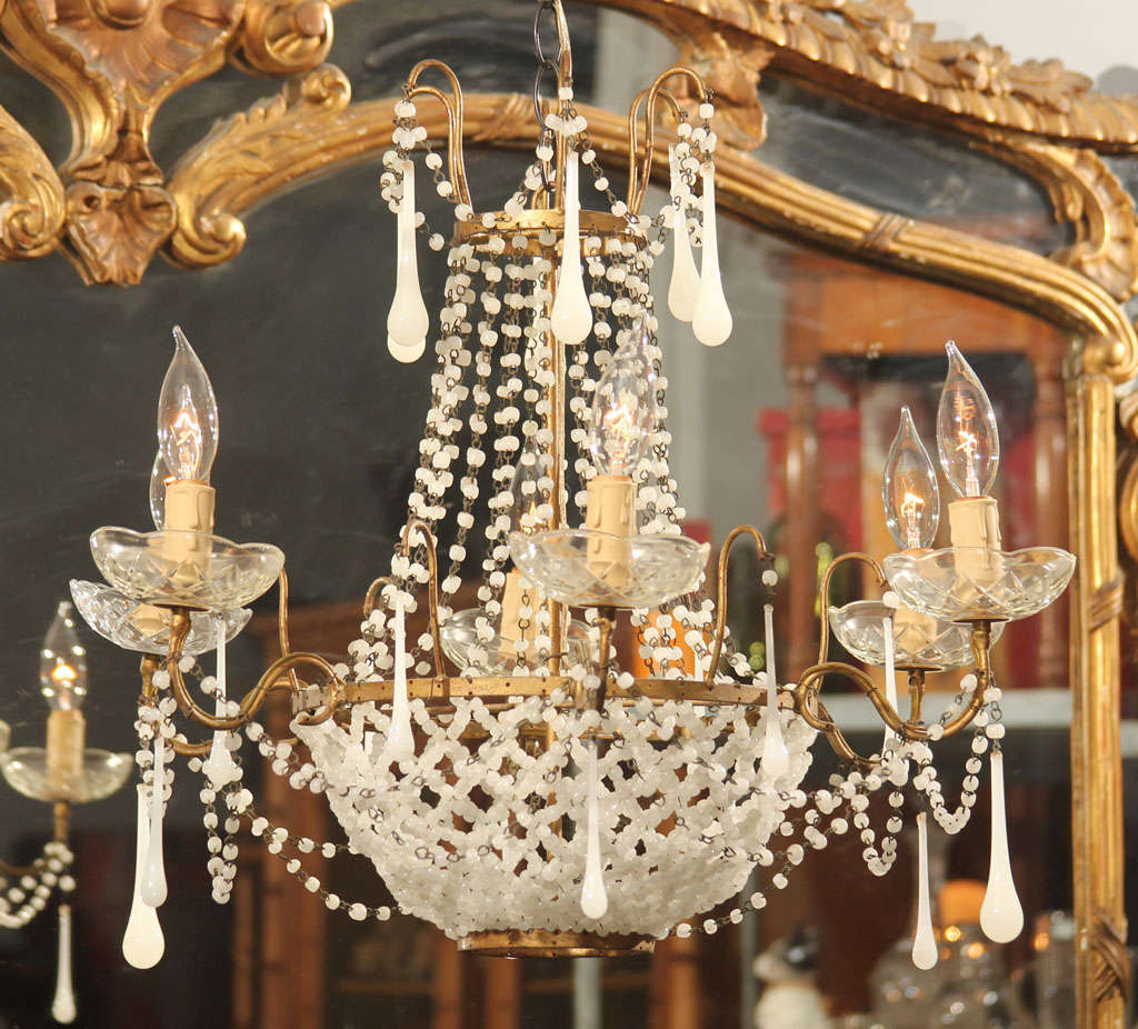 Six-arm Italian glass chandelier trimmed in drops and beads.