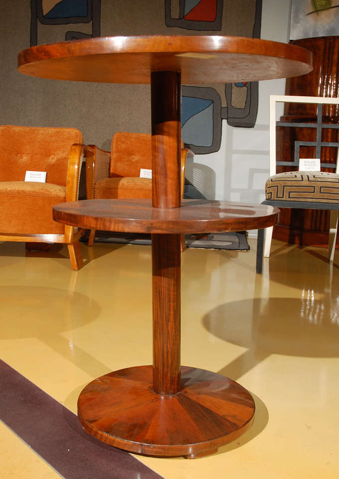 Walnut, multi-layered round table.