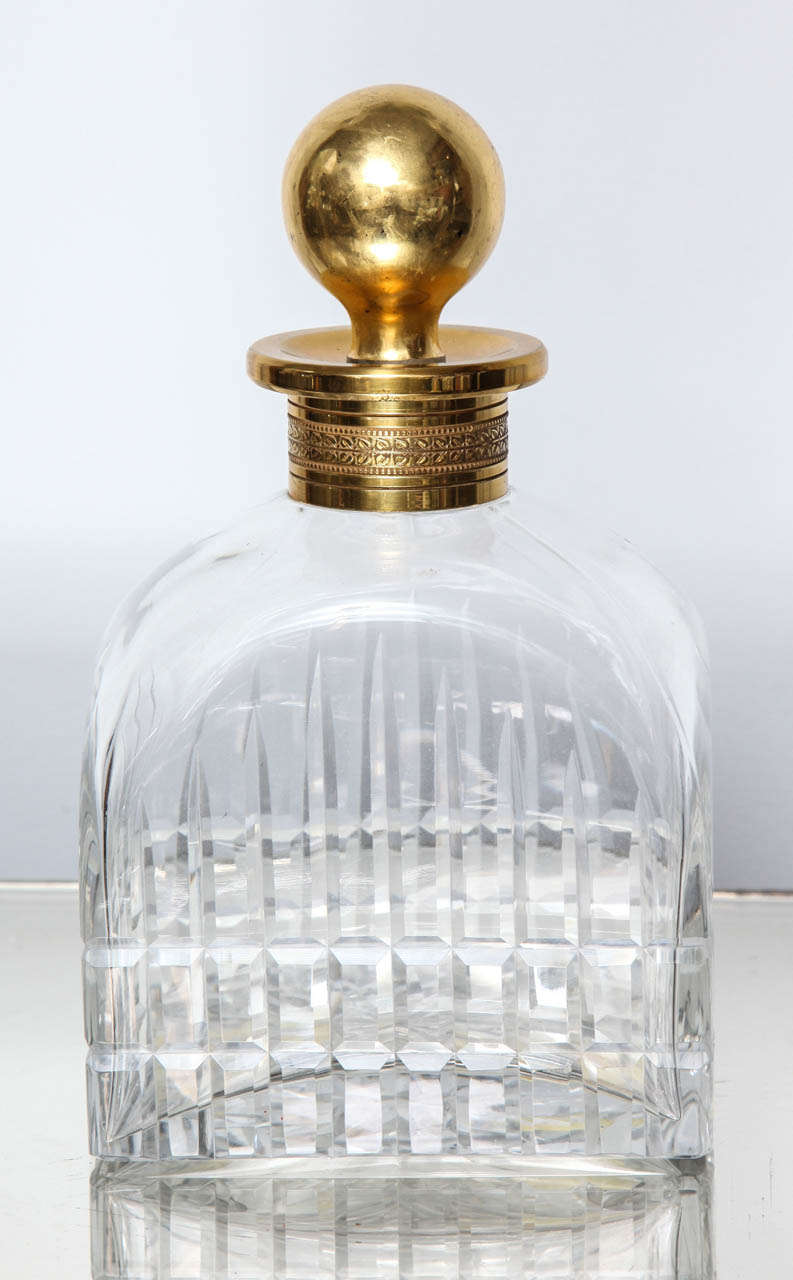 A wonderful substantial cut crystal decanter with gilded decorated collar and matching stopper