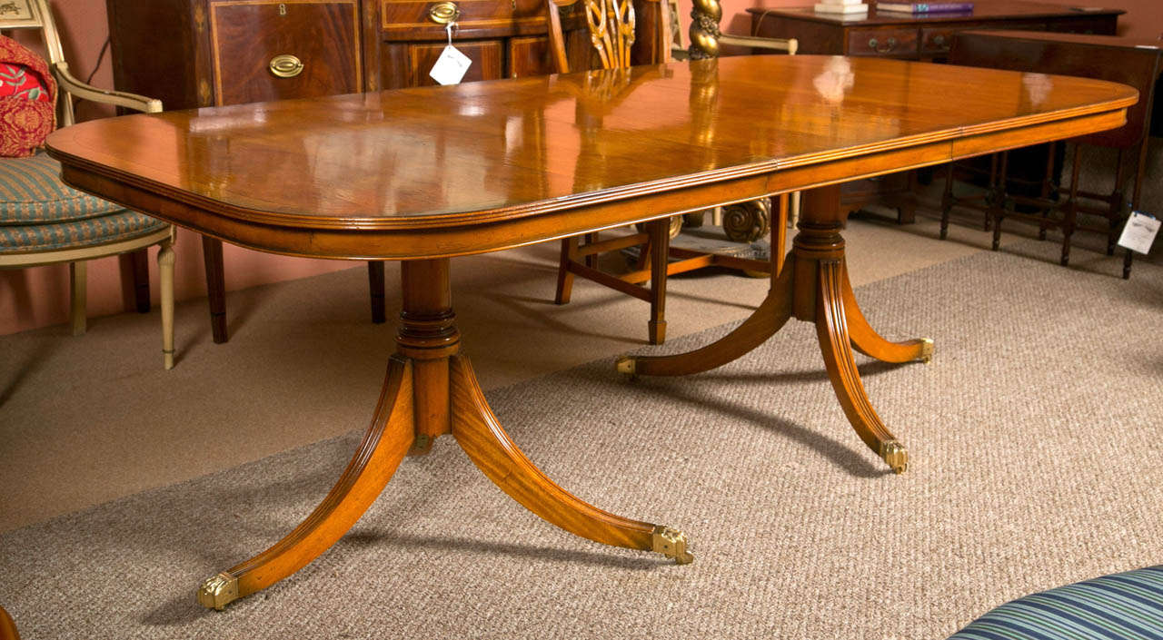 Regency style mahogany dining table by Charles Barr, comes with two 20