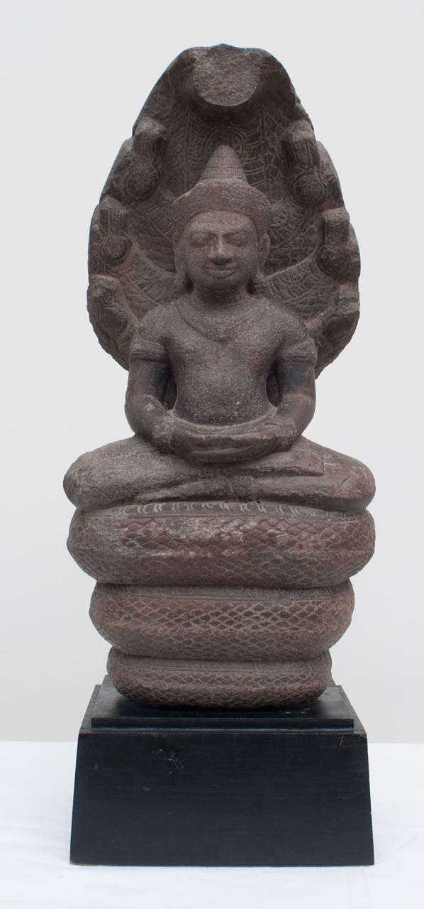 An early South East Asian carved stone Buddha.