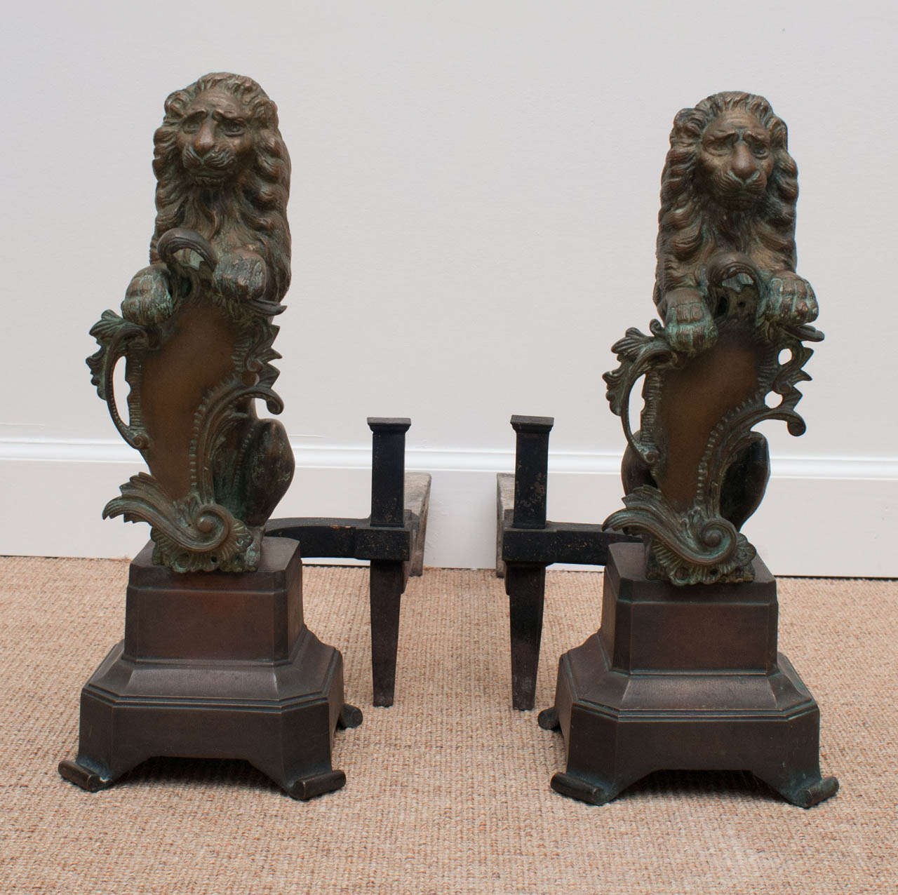 Pair of Nineteenth Century Continental sculptural bronze lion andirons, circa 1880.