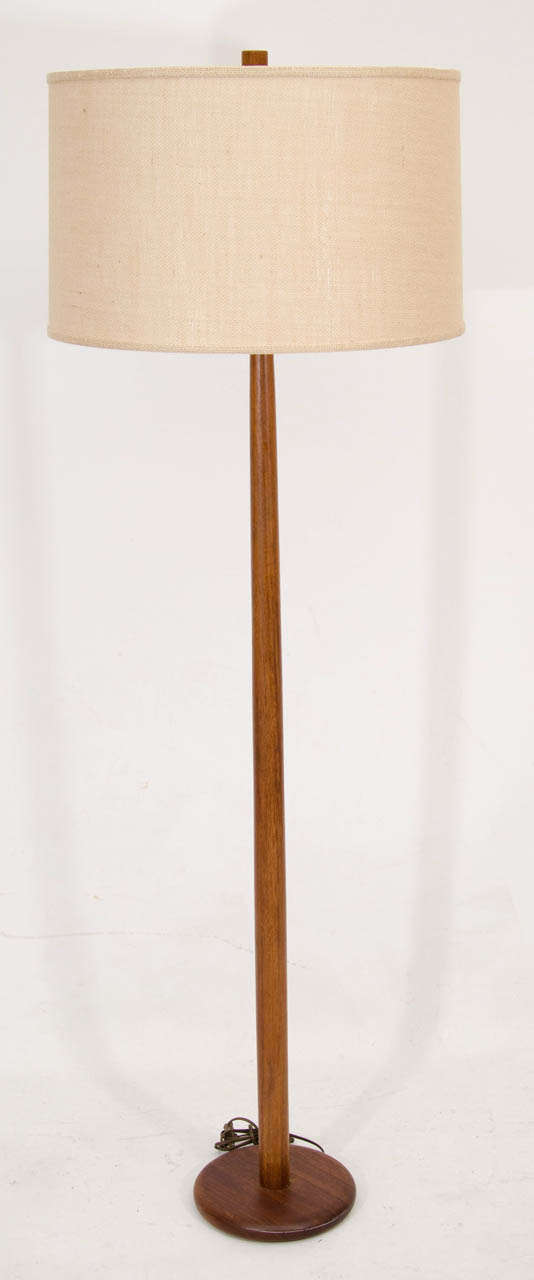 Very handsome walnut floor lamp by Gordon Martz for Marshall Studios. The pole has a nice, subtle taper that visually extends to the walnut finial.