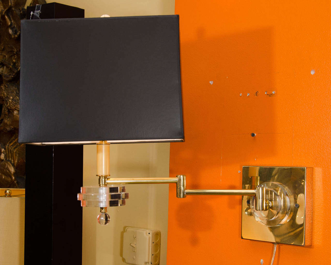 Pair of Brass and Lucite Swing Arm Wall Sconces
