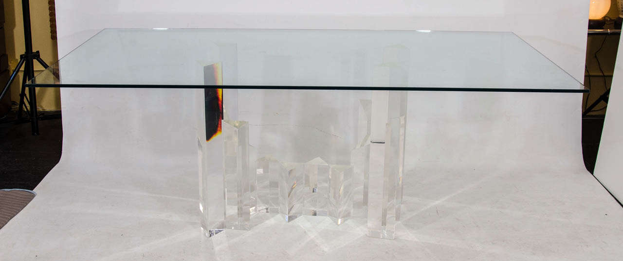 Gorgeous, striking lucite table base! The lucite triangular elements are very clear and prismatic and arranged in a staggered cityscape effect. We are selling the base only; shown in these photos with a sample rectangular piece of glass. The base