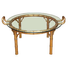 A Round Coffee Table With Carved and Giltwood Faux Bamboo Base