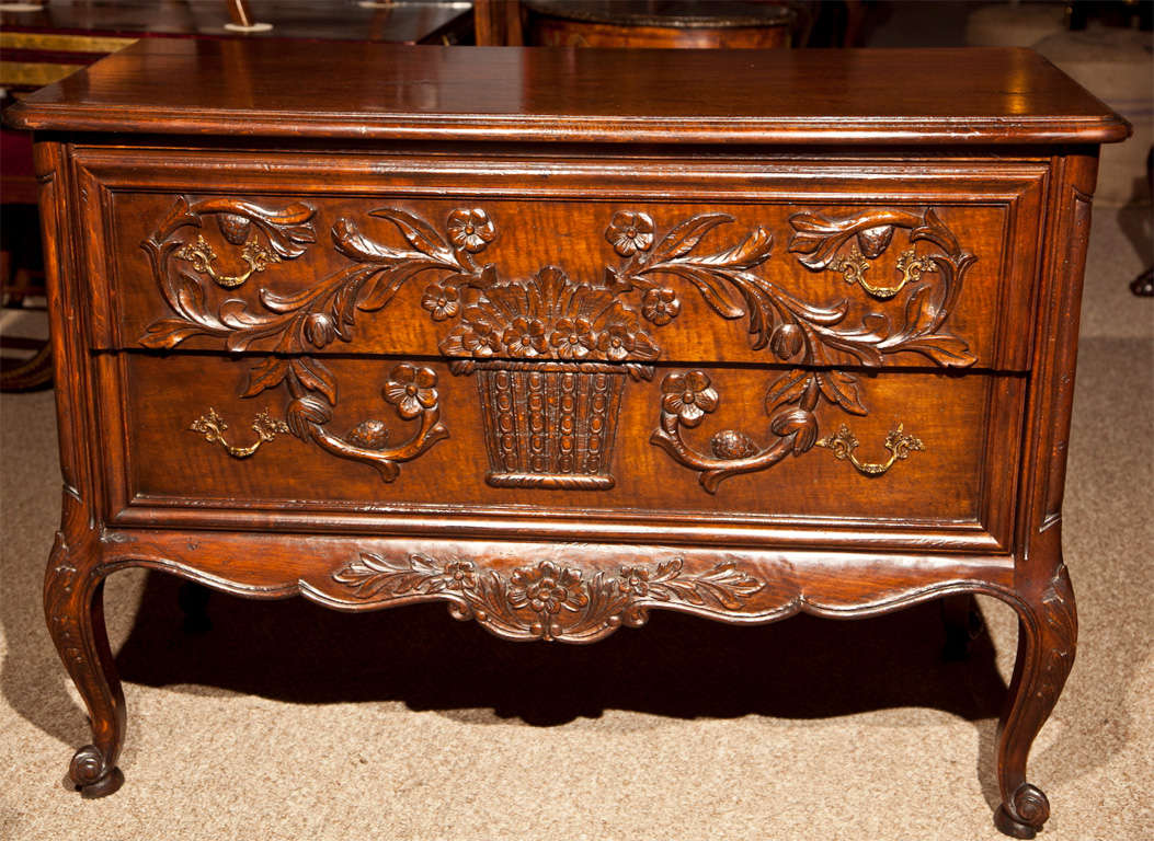 Pair of Carved Louis XV Style two drawer commodes by Don Rousseau. The floral carved drawers are of solid construction. Supported by Louis XV style feet and carbiole legs.