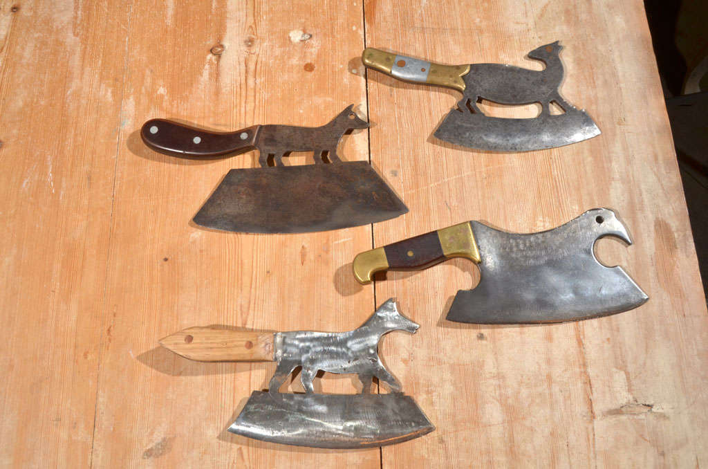 French folk art animal figures made into hatchets.  Handles, often made to resemble the tail, made from wood and/or metal.