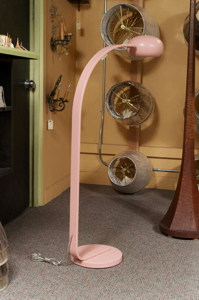 This Fun 1960's Powder Pink Floor Lamp has a nice sculptural design. The Mushroom style pink shade swivels to adjust the light for better lighting. The maker of this lamp is unknown, but it has been rewired and is in good condition, considering the