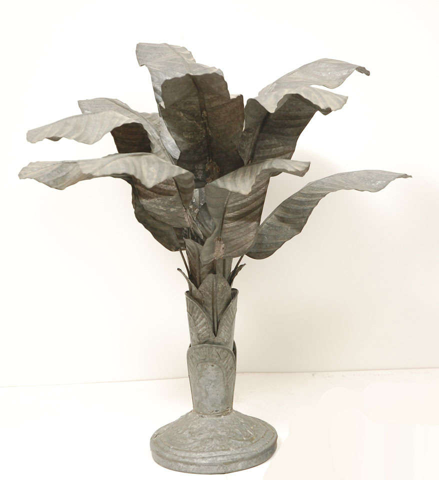 WHIMSICAL PAIR OF DARK TIN CANDLESTICKS WITH A PATINATED ZINC LIKE COLOR. HANDSOMELY RENDERED WITH  REMOVEABLE LEAVES. 