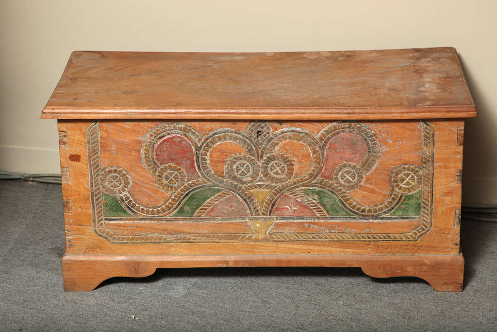 A Javanese Dutch Colonial style teak wedding trunk, hand-carved and painted from the first half of the 20th century. This Dutch Colonial style teak wedding trunk was hand-carved and painted on the island of Java in the 1920s. The simple rectangular