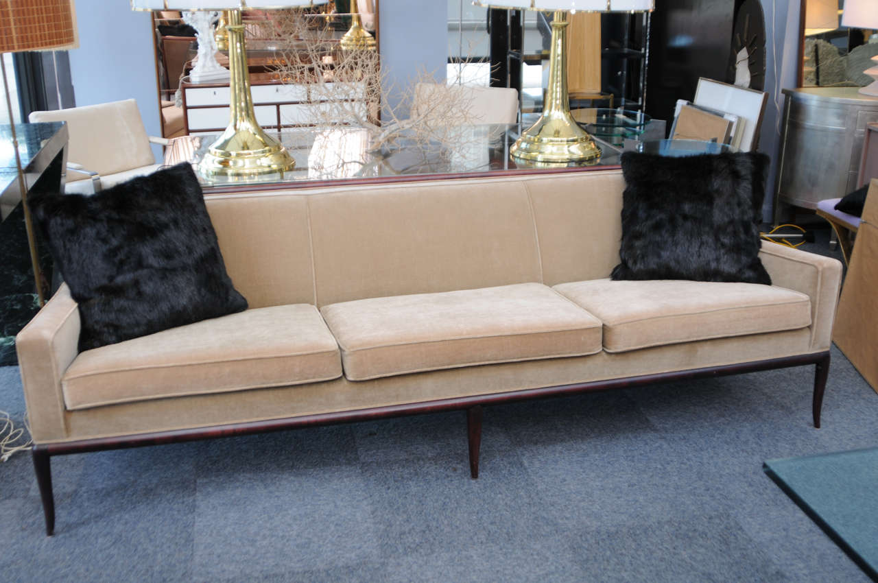 This rare long Robsjohn-Gibbings sofa with full wood trim and original vintage velvet upholstery.  It looks great as-is.