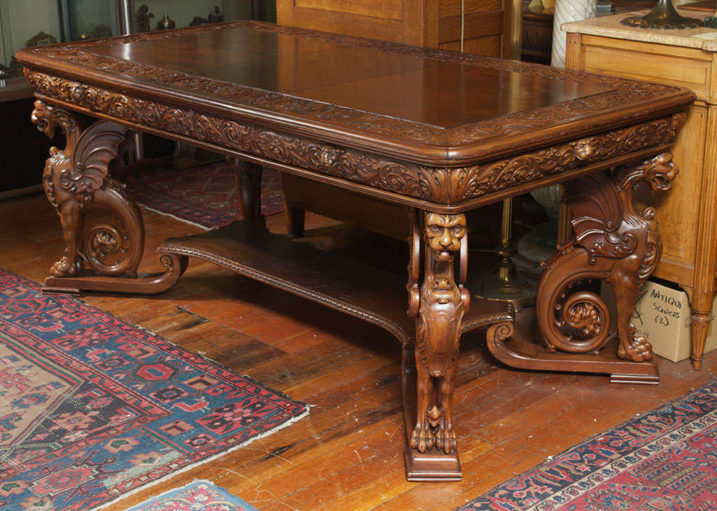 This exceptionally carved and impressive mahogany library table will make anybody into an instant executive.  While we can't guarantee it is by the noted company R.J. Horner, we certainly feel it is possible and is certainly in their manner.  Note